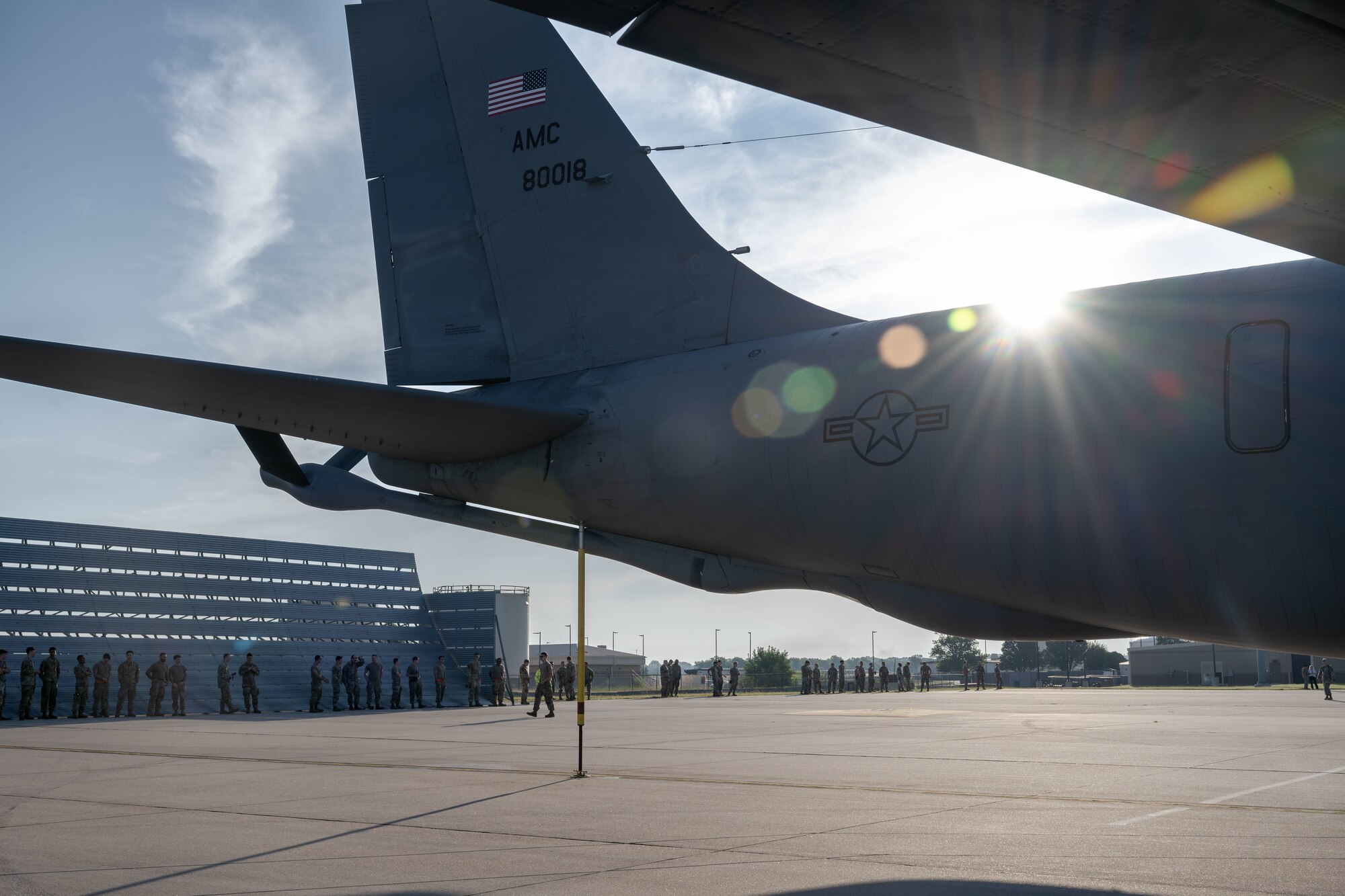 Airmen from the 722nd Aircraft Maintenance Squadron and the 22nd Maintenance Squadron participate in a weekly foreign object debris (FOD) walk at McConnell Air Force Base, Kansas, Aug. 12, 2025. FOD included materials such as rocks, dead bugs, loose hardware, and other litter. (U.S. Air Force photo by Airman 1st Class Paula Arce)