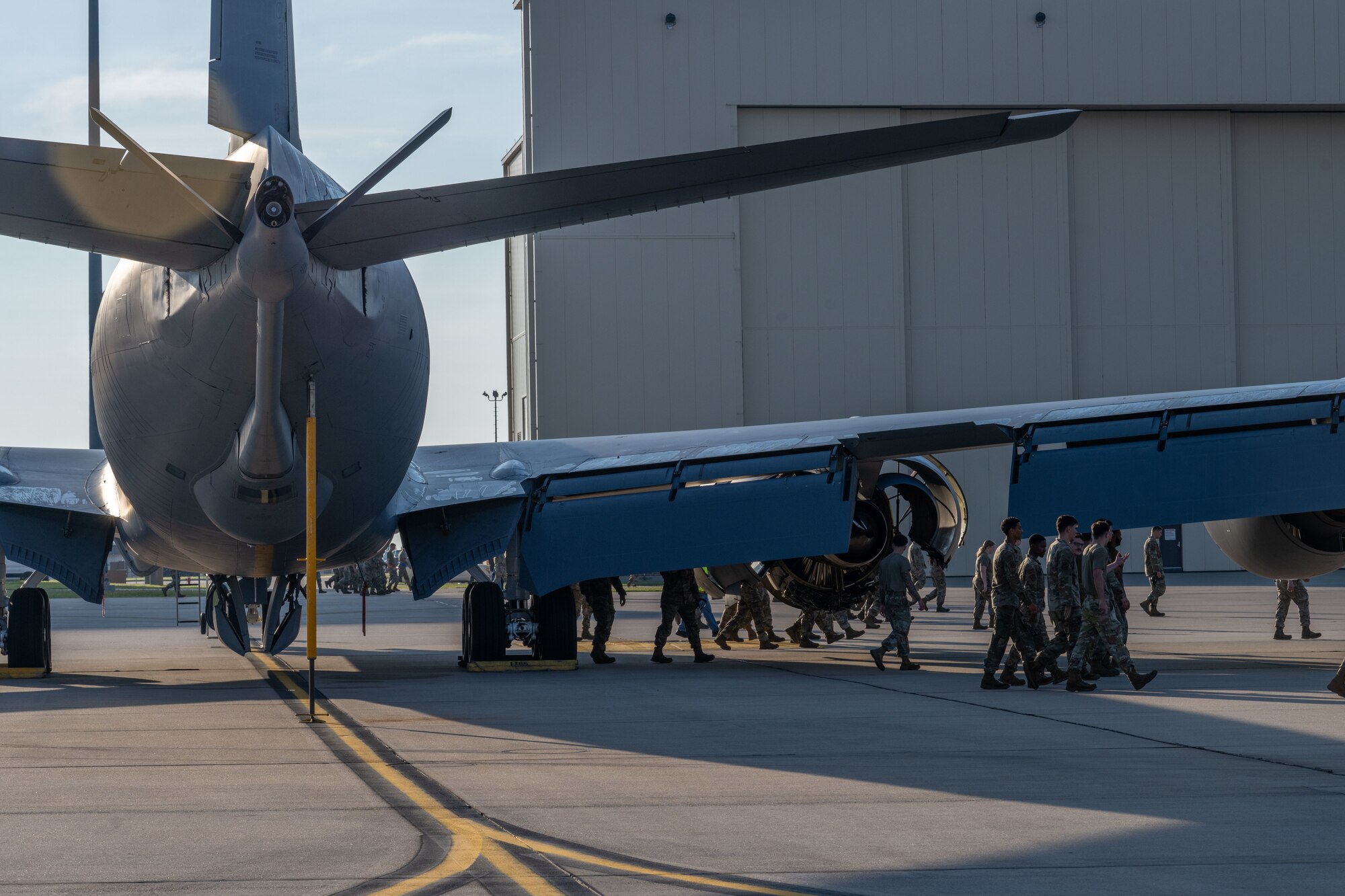 Airmen from the 722nd Aircraft Maintenance Squadron and the 22nd Maintenance Squadron participate in a weekly foreign object debris (FOD) walk at McConnell Air Force Base, Kansas, Aug. 12, 2025. FOD walks are performed at a smaller scale daily, and at a larger scale weekly. (U.S. Air Force photo by Airman 1st Class Paula Arce)