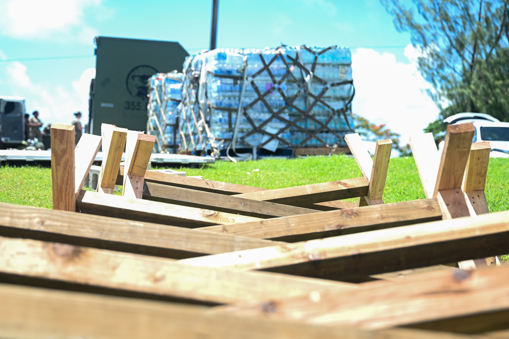 Fence posts lie on the ground before use as a perimeter for the 11th Air Task Force site in Saipan, Northern Mariana Islands, July 16, 2025, during exercise Resolute Force Pacific. The 11 ATF functions as a deployable, self-sustaining force, showcasing its adaptability and capability to operate similarly to a traditional Air Force wing. (U.S. Air Force photo by Senior Airman Andrew Garavito)