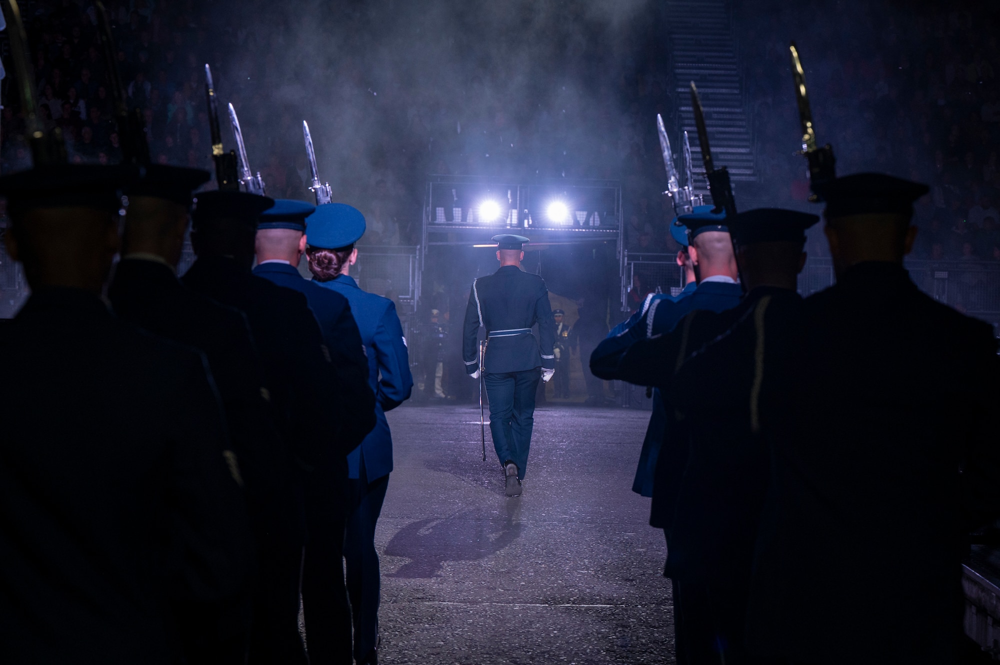 U.S. Air Force Capt. Andrew Paquin, ceremonial operations officer in charge of the U.S. Air Force Honor Guard Drill Team, marches into the performance area with members of the Drill Team during the 75th Royal Edinburgh Military Tattoo in Edinburgh, Scotland, Aug. 1, 2025. Military bands and drill teams from the U.S., United Kingdom, Switzerland, Canada, Germany, Poland, and Ukraine performed during the 24-day event. (U.S. Air Force photo by Hayden Hallman)