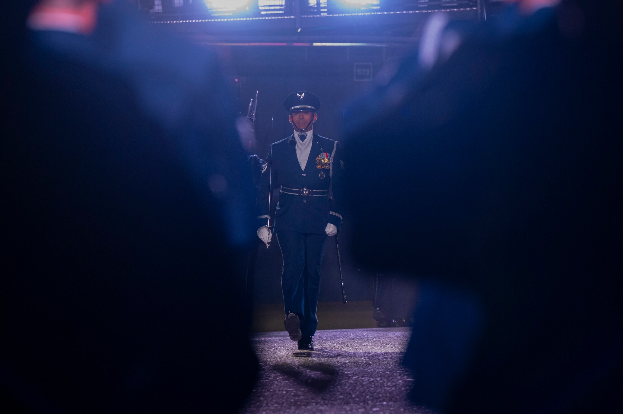 U.S. Air Force Tech. Sgt. Michael Mendoza, U.S. Air Force Honor Guard Drill Team flight chief, marches into the performance area with members of the Drill Team during rehearsal for the 75th Royal Edinburgh Military Tattoo in Edinburgh, Scotland, July 31, 2025. Military bands and drill teams from the U.S., United Kingdom, Switzerland, Canada, Germany, Poland, and Ukraine performed during the 24-day event. (U.S. Air Force photo by Hayden Hallman)