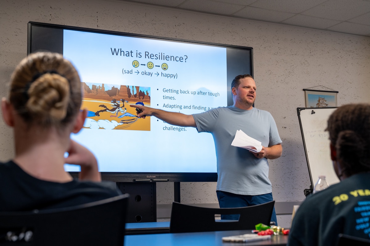 Joshua Fly, 374th Airlift Wing school liaison program manager, explains the meaning of resilience to students during the Student Ambassador Training Program at the Military and Family Readiness Center on Yokota Air Base, Japan.