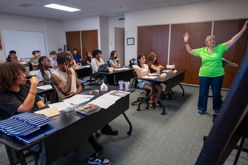 Leslie Cardona, Sexual Assault Response Coordinator, leads a lesson on critical incident stress management during the Student Ambassador Training Program at the Military and Family Readiness Center on Yokota Air Base, Japan.