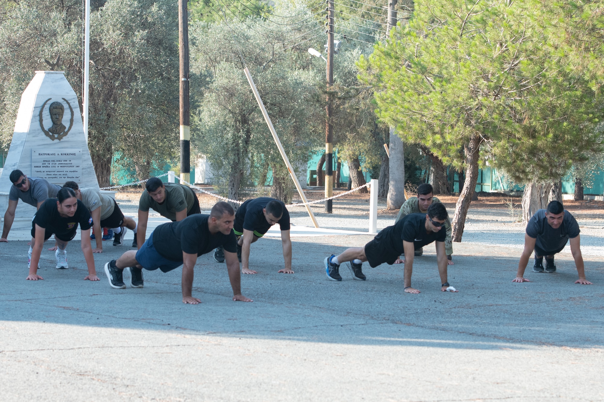 Non-commissioned officers of the Cypriot National Guard and New Jersey National Guard participate in physical fitness exercises.