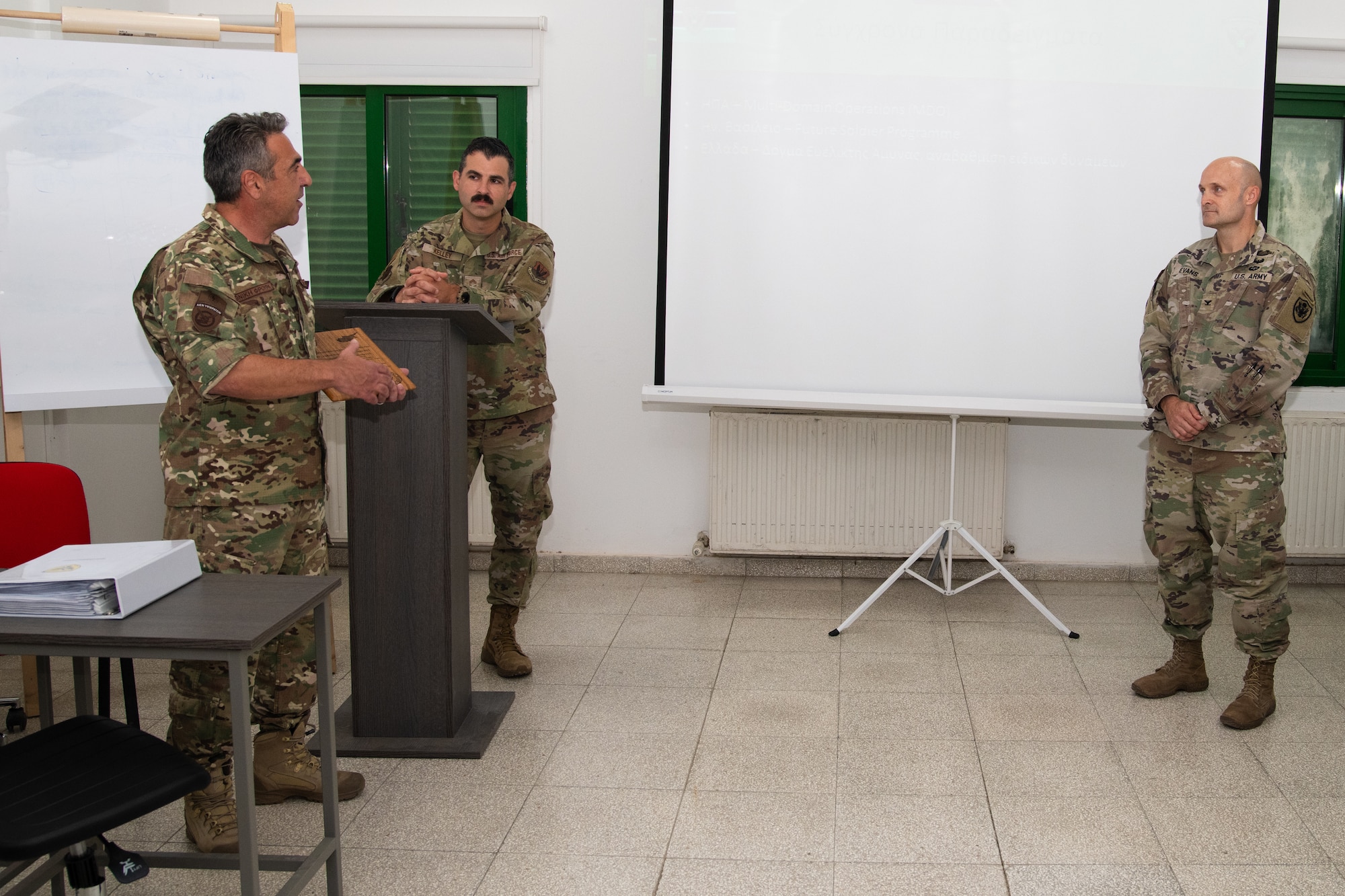 Cyprus Air National Guard Warrant Officer Andreas Christoforou, Non-commissioned Officer (NCO) Basic Leadership course lead observer and instructor, U.S. Air Force Chief Master Sgt. Justin Kelley, 177th Fighter Wing Staff senior enlisted leader, and U.S. Army Col. K.C. Evans, U.S. Embassy Cyprus senior defense official and defense attaché, talk during an NCO leadership development course.