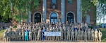 Service members from across the United States armed forces pose for a group photo before launching Operation Healthy Ellwood, Ellwood City, Pennsylvania, July 22, 2025. Operation Healthy Ellwood is supported through the Department of Defense's Innovative Readiness Training program that aligns mission-essential training with community needs.
