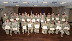 Wright-Patterson Air Force Base senior airmen selected for promotion to staff sergeant pose for a group photo at the Wright-Patt Club, Aug. 8, 2025. Air Force officials selected 15,894 senior airmen for promotion to staff sergeant out of 47,007 eligible, a selection rate of 33.81 percent in the 25E5 promotion cycle, 165 of which are based at Wright-Patt. (U.S. Air Force photo by Daniel Peterson)