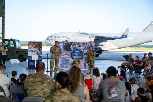 Col. Dustin Richards, 88th Air Base Wing Commander and installation commander, Chief Master Sgt. Tessa Fontaine, 88th Air Base Wing Command Chief, give opening remarks for the Kids Understanding Deployment Operations (KUDOS) event Aug. 8, 2025, at Wright-Patterson Air Force Base, Ohio. KUDOS teaches children about deployments through age-appropriate activities. (U.S. Air Force photo by Jack Gardner)