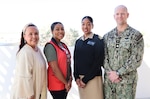 Customer Service Officer Gina Buffaloe (left), American Red Cross Volunteer Kiera Martin (left-center), Cmdr. Christine Higgins (right-center), and American Red Cross liaison Chaplain Lt. Cmdr. Nicholas Suddath (right) pictured at Robert E. Bush Naval Hospital, August 5, 2025. The group is part of a renewed effort between the hospital’s Patient and Family Partnership Council and the American Red Cross to reestablish a strong volunteer presence, with Martin— a nursing student and military spouse—already making a notable impact at command events. (Official U.S. Navy Photo by Christopher Jones, NHTP/NMRTC Twentynine Palms public affairs officer).