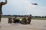 Members with the Critical Care Air Transport Team (CCATT) and Aeromedical personnel participate in a joint exercise at the Wyoming Air National Guard base in Cheyenne, Wyo., on Aug. 1, 2025.