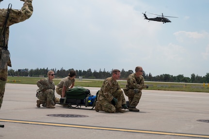 Members with the Critical Care Air Transport Team (CCATT) and Aeromedical personnel participate in a joint exercise at the Wyoming Air National Guard base in Cheyenne, Wyo., on Aug. 1, 2025.
