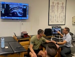Lt. Col. Jon Umlauf, Associate Professor, George Washington University Doctor of Physical Therapy Program, demonstrates the utility of point-of-care ultrasound (POCUS) as a valuable tool in forward battlefield medicine during the Kersey Advanced Clinical & Operational Practice Course held at West Point on August 4-8, 2025. POCUS provides immediate diagnostic information in austere, resource-limited environments.