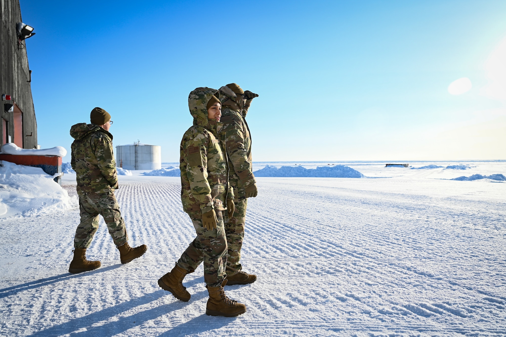 The U.S. Air Force Air Combat Command Acquisition Management and Integration Center Detachment 1 team walks through the Arctic tundra inspecting the operational readiness of the North Warning System Site FOX-M Hall Beach.