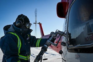 A helicopter is refueled at North Warning System Site FOX-M Hall Beach.