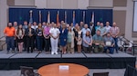 NSWC Crane celebrates employee success at Annual Command Awards. Employees photographed with NSWC Crane leadership.