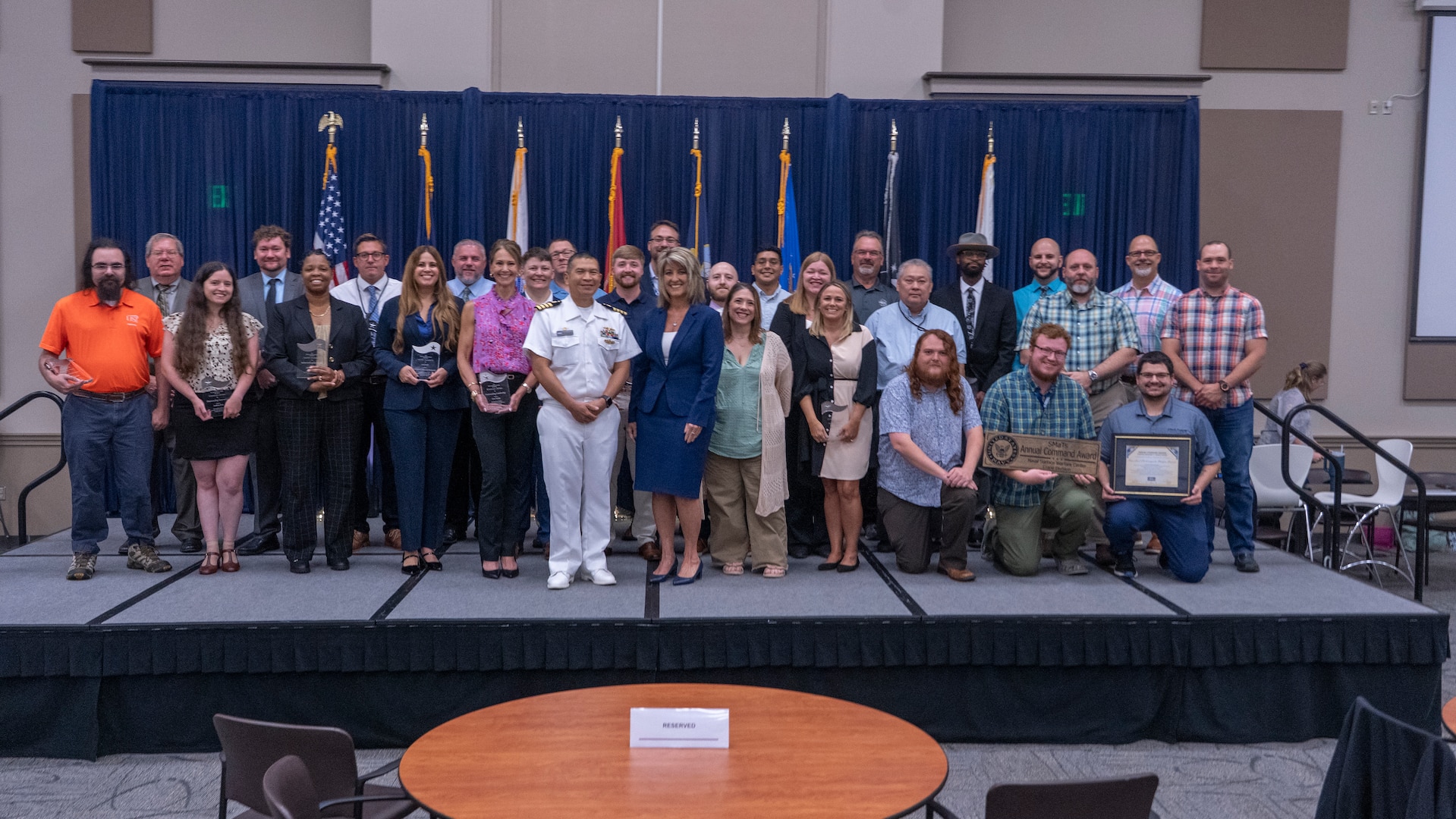 NSWC Crane celebrates employee success at Annual Command Awards. Employees photographed with NSWC Crane leadership.