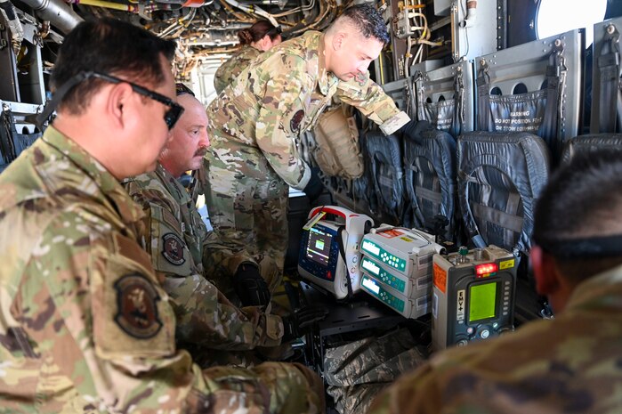 A group of airmen with medical supplies inside an aircraft