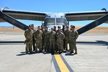 A group of Airmen in front of an Aircraft