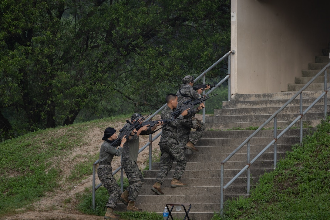 Republic of Korea Marines assault a building during bilateral military operations in urban terrain training during the Korean Marine Exercise Program 25.2 in Pocheon, South Korea, July 25, 2025. KMEP is conducted regularly between the ROK and U.S. Marine Corps to increase their combined capabilities through realistic training geared towards deterrence and maintaining peace in the Indo-Pacific. (U.S. Marine Corps photo by Lance Cpl. Van Hoang)