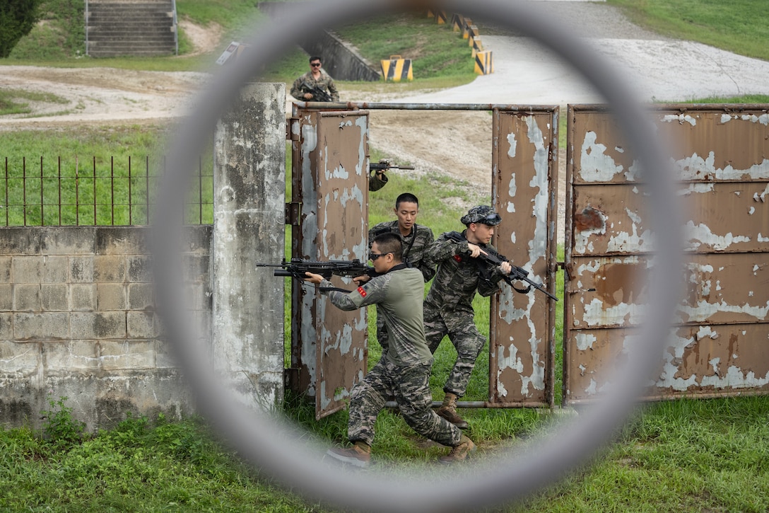 Republic of Korea Marines cross a street to assault a building during bilateral military operations in urban terrain training during the Korean Marine Exercise Program 25.2 in Pocheon, South Korea, July 24, 2025. KMEP is conducted regularly between the ROK and U.S. Marine Corps to increase their combined capabilities through realistic training geared towards deterrence and maintaining peace in the Indo-Pacific. (U.S. Marine Corps photo by Lance Cpl. Van Hoang)