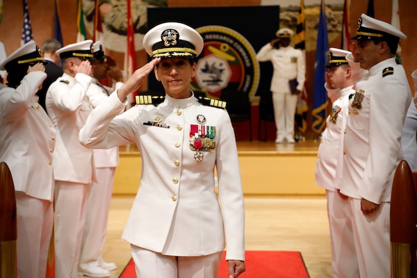 SILVER SPRING, Md. (Aug. 13, 2025) Capt. Franca Jones departs through ceremonial sideboys during Naval Medical Research Command's (NMRC) Change of Command ceremony. The ceremony, presided over by Rear Adm. Guido Valdes, saw Jones relieved as commander by Capt. Eric Welsh. Valdes recently served as commander, Naval Medical Forces Pacific. NMRC, headquarters of Navy Medicine Research & Development, is engaged in a broad spectrum of activity from basic science in the laboratory to field studies in austere and remote areas of the world to investigations in operational environments. In support of Navy, Marine Corps and joint U.S. warfighter health, readiness and lethality, researchers study infectious diseases, biological warfare detection and defense, combat casualty care, environmental health concerns, aerospace and undersea medicine, operational mission support and epidemiology. (U.S. Navy Photo by Tommy Lamkin/ released)