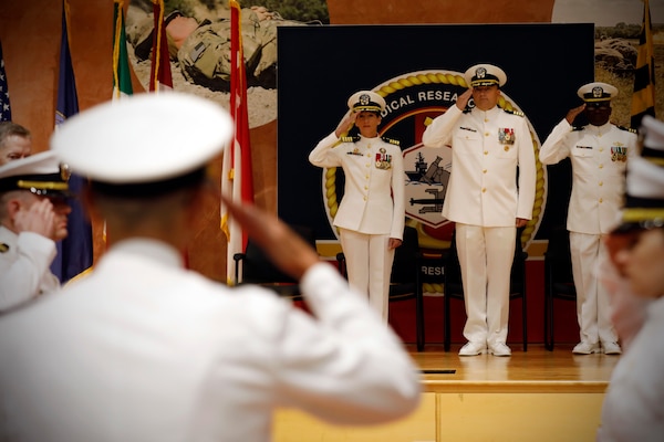 SILVER SPRING, Md. (Aug. 13, 2025) Capt. Franca Jones, commander, Naval Medical Research Command (NMRC), and Capt. Eric Welsh salute Rear Adm. Guido Valdes as he enters through ceremonial sideboys at NMRC'S Change of Command ceremony. The ceremony, presided over by Valdes, saw Jones relieved as commander by Welsh. Valdes recently served as commander, Naval Medical Forces Pacific. NMRC, headquarters of Navy Medicine Research & Development, is engaged in a broad spectrum of activity from basic science in the laboratory to field studies in austere and remote areas of the world to investigations in operational environments. In support of Navy, Marine Corps and joint U.S. warfighter health, readiness and lethality, researchers study infectious diseases, biological warfare detection and defense, combat casualty care, environmental health concerns, aerospace and undersea medicine, operational mission support and epidemiology. (U.S. Navy Photo by Tommy Lamkin/ released)