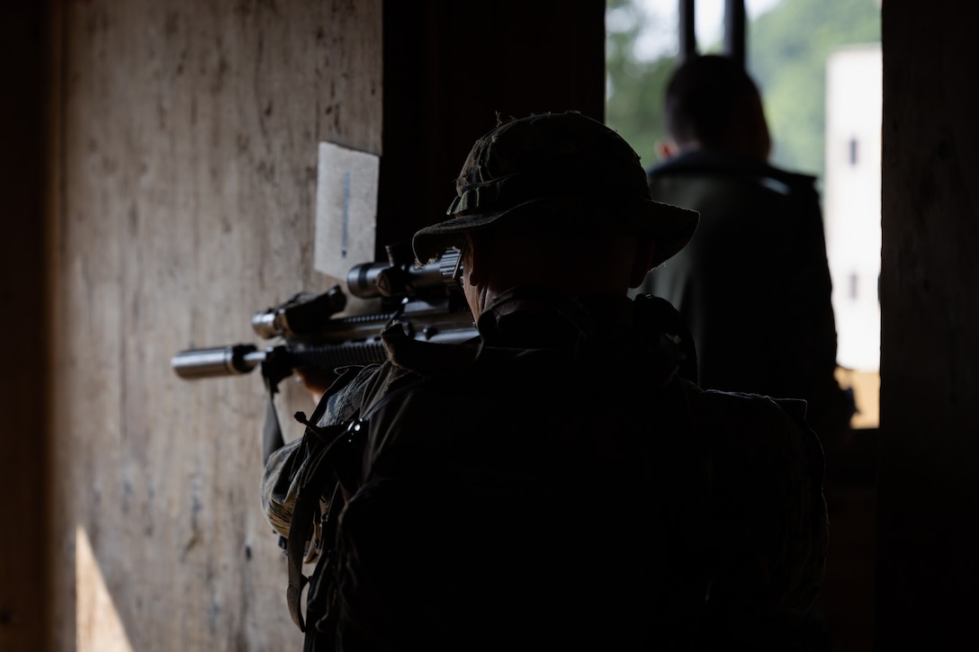 U.S. Marine Corps Cpl. Kayden Gibson, an automatic rifleman with 2nd Battalion, 23rd Marines, forward deployed with 4th Marine Regiment, 3d Marine Division as part of the Unit Deployment Program, secures a hallway as fellow U.S. and Republic of Korea Marines clear rooms during bilateral military operations in urban terrain training during the Korean Marine Exercise Program 25.2 in Pocheon, South Korea, July 25, 2025. KMEP is conducted regularly between the ROK and U.S. Marine Corps to increase their combined capabilities through realistic training geared towards deterrence and maintaining peace in the Indo-Pacific. (U.S. Marine Corps photo by Lance Cpl. Van Hoang)