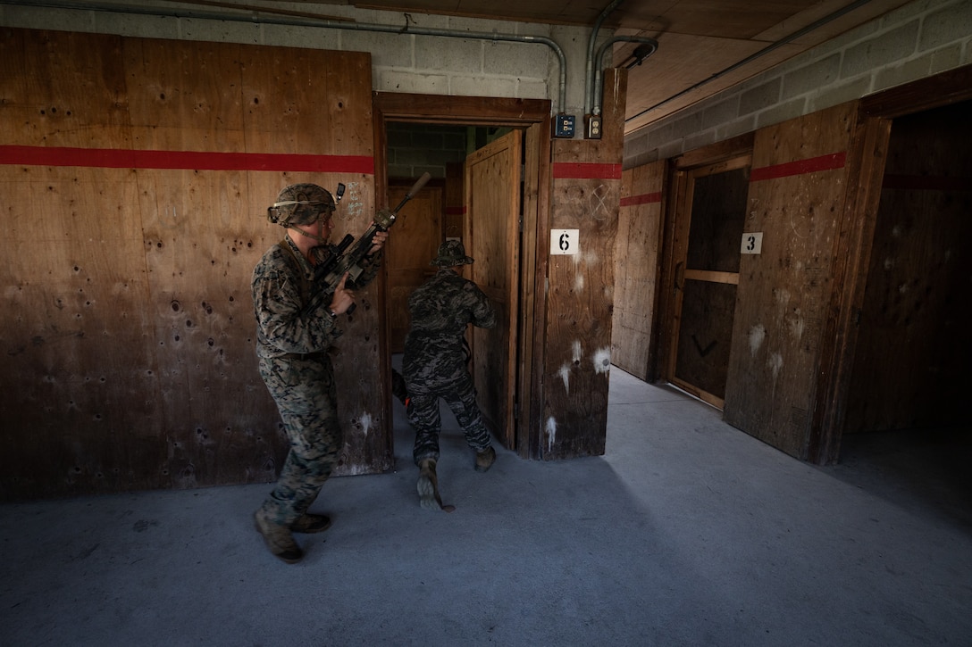 U.S. Marine Corps Cpl. Charles Biggers, left, a rifleman with 2nd Battalion, 23rd Marines, forward deployed with 4th Marine Regiment, 3d Marine Division as part of the Unit Deployment Program, and a Republic of Korea Marine breach a room during bilateral military operations in urban terrain training during the Korean Marine Exercise Program 25.2 in Pocheon, South Korea, July 25, 2025. KMEP is conducted regularly between the ROK and U.S. Marine Corps to increase their combined capabilities through realistic training geared towards deterrence and maintaining peace in the Indo-Pacific. (U.S. Marine Corps photo by Lance Cpl. Van Hoang)