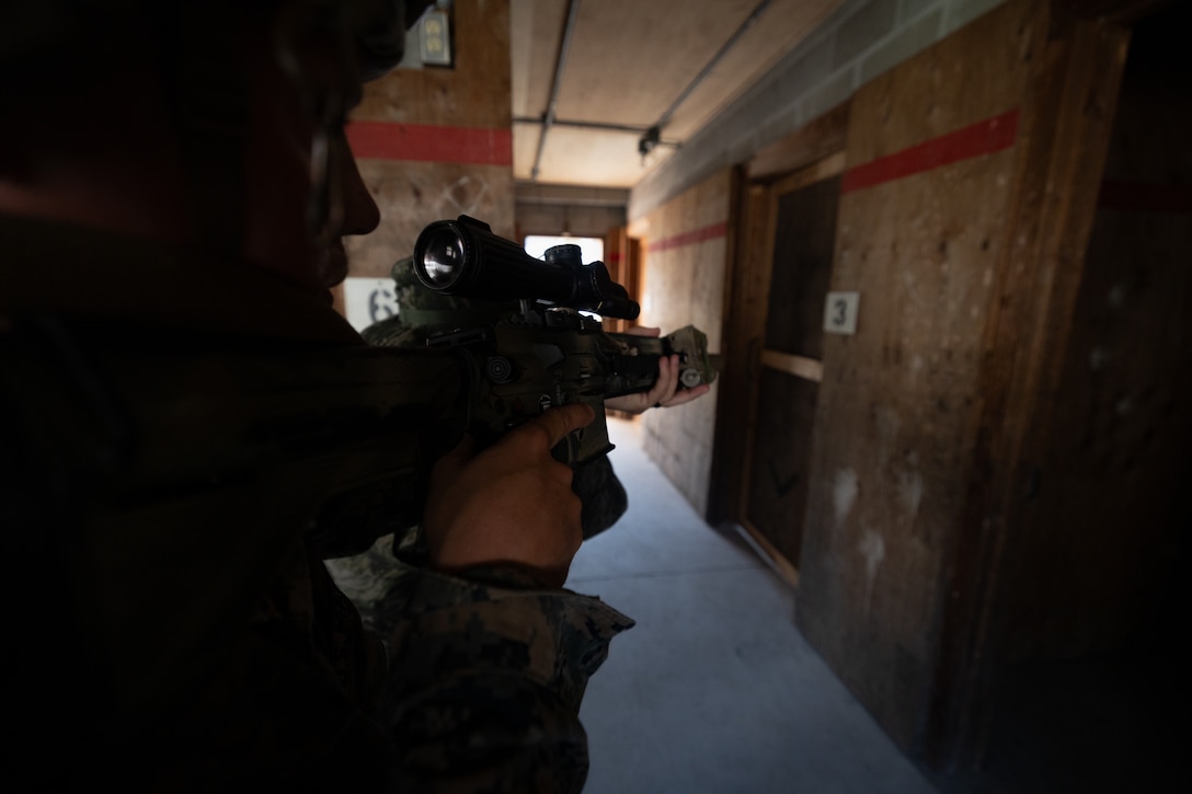 U.S. Marine Corps Cpl. Charles Biggers, a rifleman with 2nd Battalion, 23rd Marines, forward deployed with 4th Marine Regiment, 3d Marine Division as part of the Unit Deployment Program, and a Republic of Korea Marine secures a hallway during bilateral military operations in urban terrain training during the Korean Marine Exercise Program 25.2 in Pocheon, South Korea, July 25, 2025. KMEP is conducted regularly between the ROK and U.S. Marine Corps to increase their combined capabilities through realistic training geared towards deterrence and maintaining peace in the Indo-Pacific. (U.S. Marine Corps photo by Lance Cpl. Van Hoang)