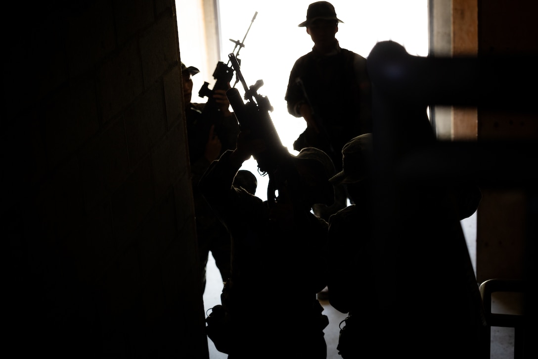 Republic of Korea Marines clear a staircase during bilateral military operations in urban terrain training during the Korean Marine Exercise Program 25.2 in Pocheon, South Korea, July 25, 2025. KMEP is conducted regularly between the ROK and U.S. Marine Corps to increase their combined capabilities through realistic training geared towards deterrence and maintaining peace in the Indo-Pacific. (U.S. Marine Corps photo by Lance Cpl. Van Hoang)