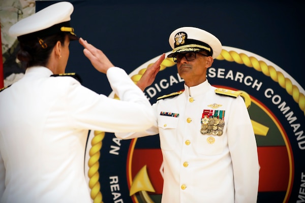 SILVER SPRING, Md. (Aug. 13, 2025) Capt. Franca Jones salutes Rear Adm. Guido Valdes, signifying that she has been relieved as commander, Naval Medical Research Command (NMRC), during NMRC'S Change of Command ceremony. The ceremony, presided over by Valdes, saw Jones relieved as commander by Capt. Eric Welsh. Valdes recently served as commander, Naval Medical Forces Pacific. NMRC, headquarters of Navy Medicine Research & Development, is engaged in a broad spectrum of activity from basic science in the laboratory to field studies in austere and remote areas of the world to investigations in operational environments. In support of Navy, Marine Corps and joint U.S. warfighter health, readiness and lethality, researchers study infectious diseases, biological warfare detection and defense, combat casualty care, environmental health concerns, aerospace and undersea medicine, operational mission support and epidemiology. (U.S. Navy Photo by Tommy Lamkin/ released)