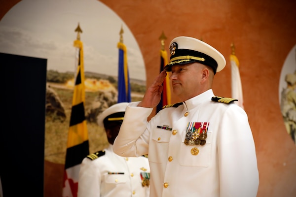 SILVER SPRING, Md. (Aug. 13, 2025) Capt. Eric Welsh salutes as he assumes command of Naval Medical Research Command (NMRC) during NMRC's Change of Command ceremony. The ceremony, presided over by Rear Adm. Guido Valdes, saw Capt. Franca Jones relieved as commander by Welsh. Valdes recently served as commander, Naval Medical Forces Pacific. NMRC, headquarters of Navy Medicine Research & Development, is engaged in a broad spectrum of activity from basic science in the laboratory to field studies in austere and remote areas of the world to investigations in operational environments. In support of Navy, Marine Corps and joint U.S. warfighter health, readiness and lethality, researchers study infectious diseases, biological warfare detection and defense, combat casualty care, environmental health concerns, aerospace and undersea medicine, operational mission support and epidemiology. (U.S. Navy Photo by Tommy Lamkin/ released)