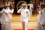 SILVER SPRING, Md. (Aug. 13, 2025) Capt. Eric Welsh, commander, Naval Medical Research Command (NMRC) departs through ceremonial sideboys during NMRC's Change of Command ceremony. The ceremony, presided over by Rear Adm. Guido Valdes, saw Capt. Franca Jones relieved as commander by Welsh. Valdes recently served as commander, Naval Medical Forces Pacific. NMRC, headquarters of Navy Medicine Research & Development, is engaged in a broad spectrum of activity from basic science in the laboratory to field studies in austere and remote areas of the world to investigations in operational environments. In support of Navy, Marine Corps and joint U.S. warfighter health, readiness and lethality, researchers study infectious diseases, biological warfare detection and defense, combat casualty care, environmental health concerns, aerospace and undersea medicine, operational mission support and epidemiology. (U.S. Navy Photo by Tommy Lamkin/ released)