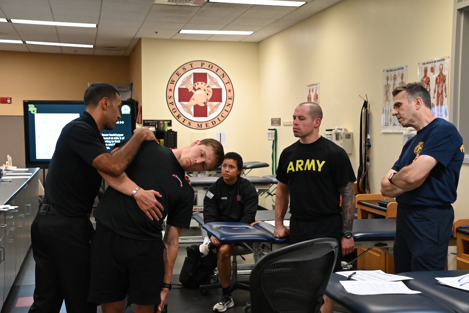 Maj. Shawn Stoute, Asst. Chief, Dept. of Physical Therapy, Keller Army Community Hospital, demonstrates standardized lumbar side bend range of motion examination techniques with therapist applied overpressure during the Kersey Advanced Clinical & Operational Practice Course held at West Point on August 4-8, 2025.