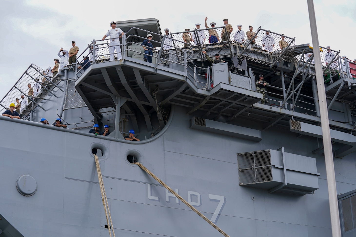 NORFOLK, Va. (Aug. 14, 2025) - Sailors and Marines man the rails aboard the Wasp-class amphibious assault ship USS Iwo Jima (LHD 7) as it departs Naval Station Norfolk for a regularly scheduled deployment. Sailors and Marines of the Iwo Jima Amphibious Ready Group (IWO ARG) - 22nd Marine Expeditionary Unit (MEU) Special Operations Capable (SOC) departed Norfolk and Camp Lejeune, North Carolina after completing a comprehensive, nine-month training program. (U.S. Navy photo by Mass Communication Specialist 1st Class Clay Whaley)