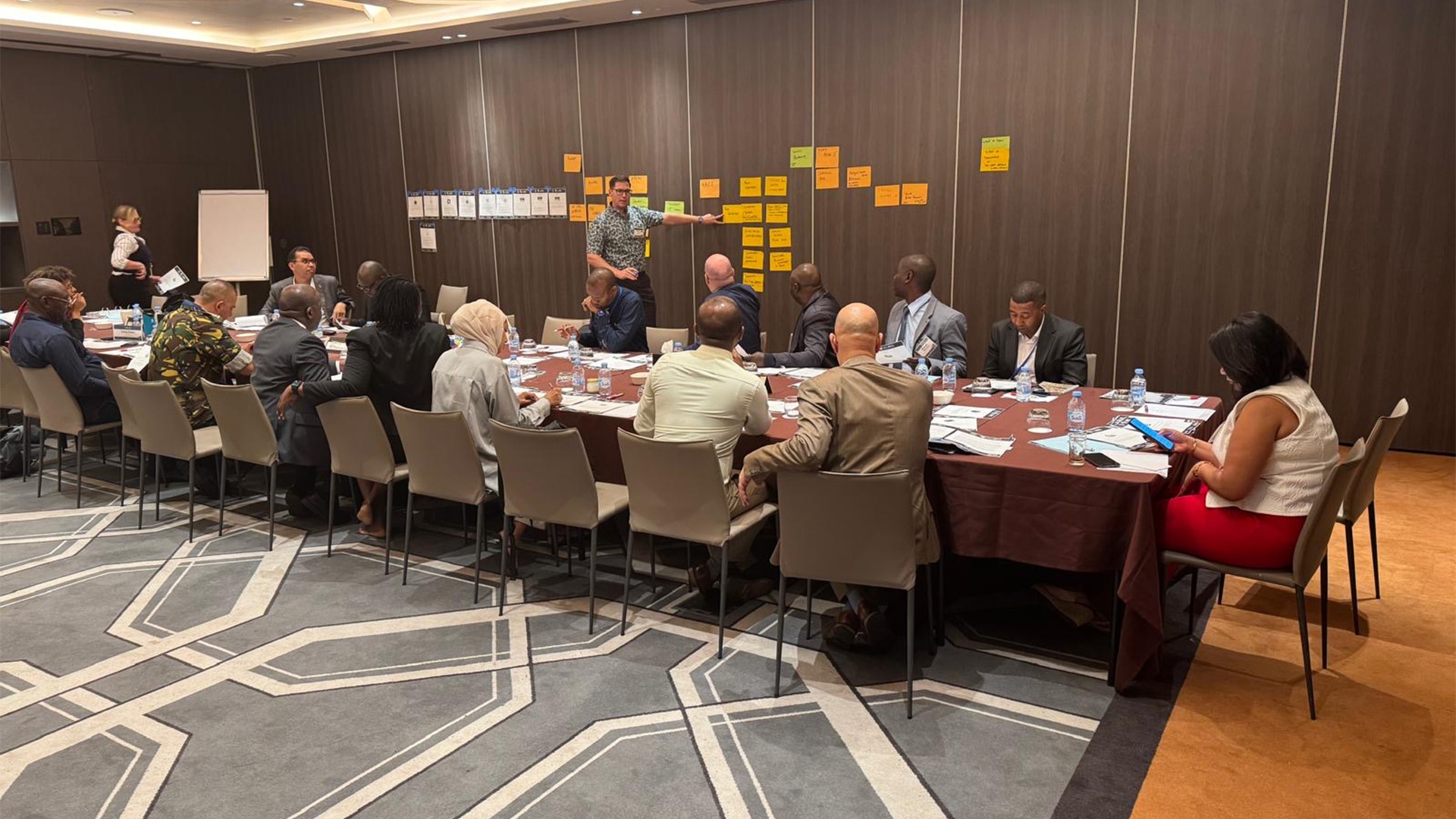 workshop participants around a long rectangular table