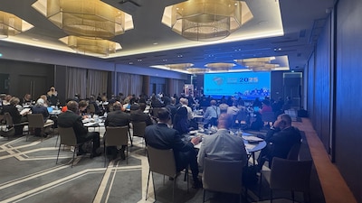 wide view from workshop hall with participants