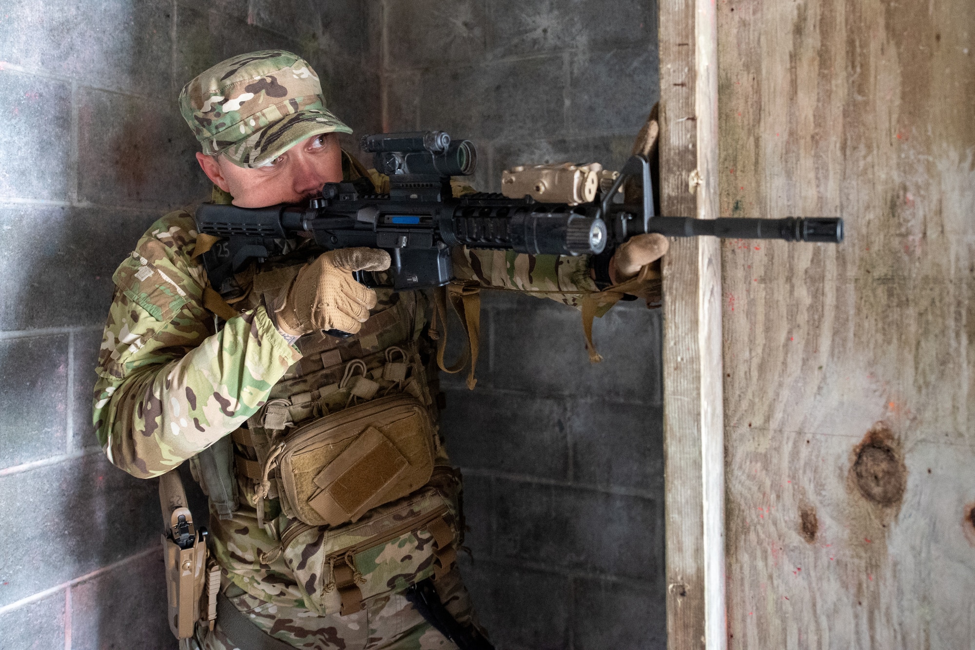 Tech. Sgt. Franklin Sloat, a security forces member with the Kentucky Air National Guard’s 123rd Contingency Response Group, maintains security during a close-quarters battle exercise at the Alpena Combat Readiness Training Center in Alpena, Mich., May 23, 2025. More than 50 Airmen from the Kentucky Air Guard, along with members of the Colorado Air National Guard’s 233rd  Security Forces Squadron and the Ecuadorian Air Force, participated in a nine-day field exercise here May 21 to 29. (U.S. Air National Guard photo by Phil Speck)