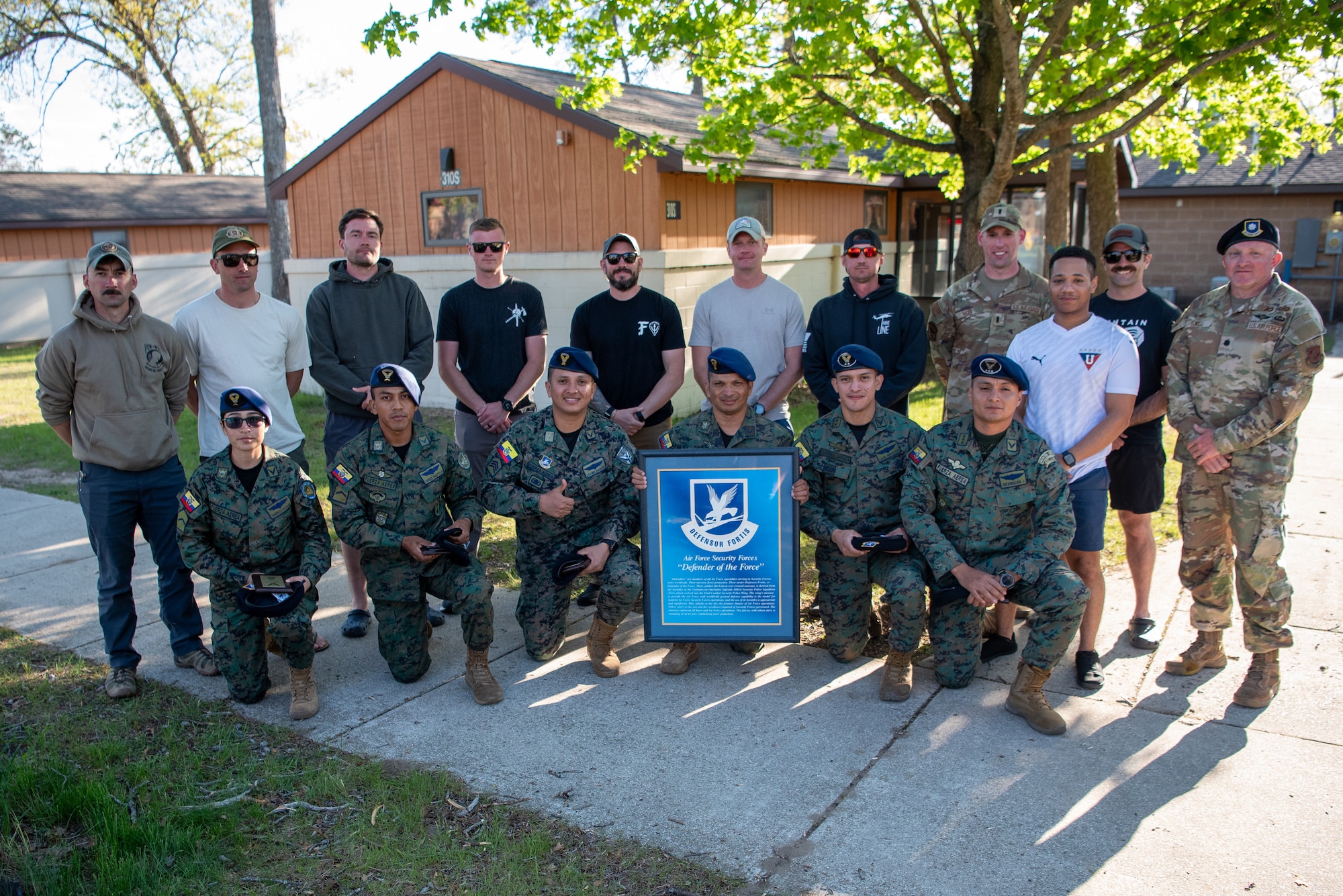 Leaders from the Kentucky Air National Guard’s 123rd Security Forces Squadron and 123rd Contingency Response Group present tokens of friendship to members of the Ecuadorian Air Force at the Alpena Combat Readiness Training Center in Alpena, Mich., May 26, 2025. More than 50 Airmen from the Kentucky Air Guard’s 123rd SFS and 123rd CRG, along with members of the Colorado Air National Guard’s 233rd Security Forces Squadron, joined with the Ecuadorians for a nine-day field exercise here May 21 to 29. (U.S. Air National Guard photo by Phil Speck)
