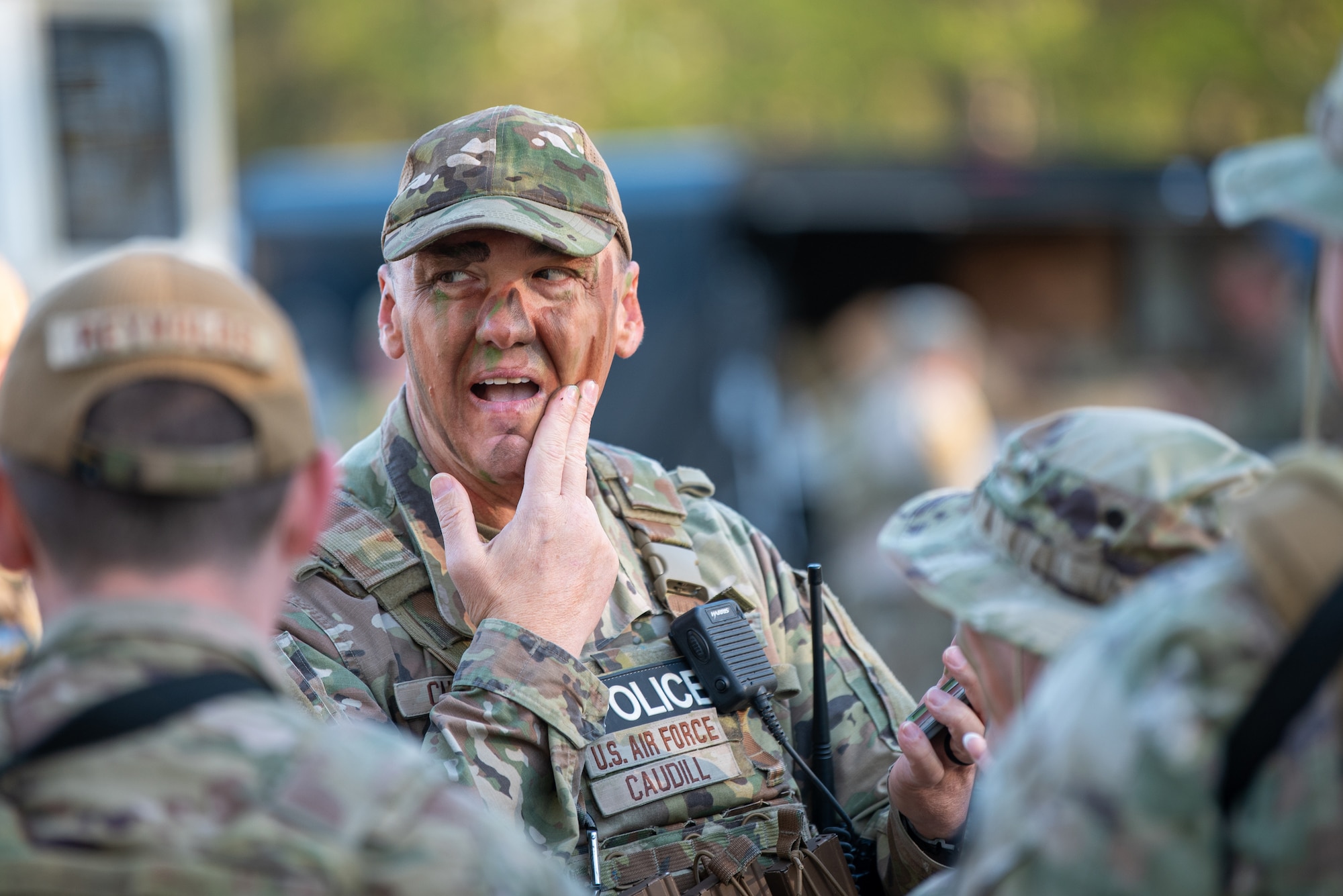 Staff Sgt. Michael Caudill, a fireteam member with the Kentucky Air National Guard’s 123rd Security Forces Squadron, applies camouflage paint prior to a field exercise at the Alpena Combat Readiness Training Center in Alpena, Mich., May 26, 2025. More than 50 Airmen from the Kentucky Air Guard, along with members of the Colorado Air National Guard’s 233rd  Security Forces Squadron and the Ecuadorian Air Force, participated in a nine-day field exercise here May 21 to 29. (U.S. Air National Guard photo by Phil Speck)