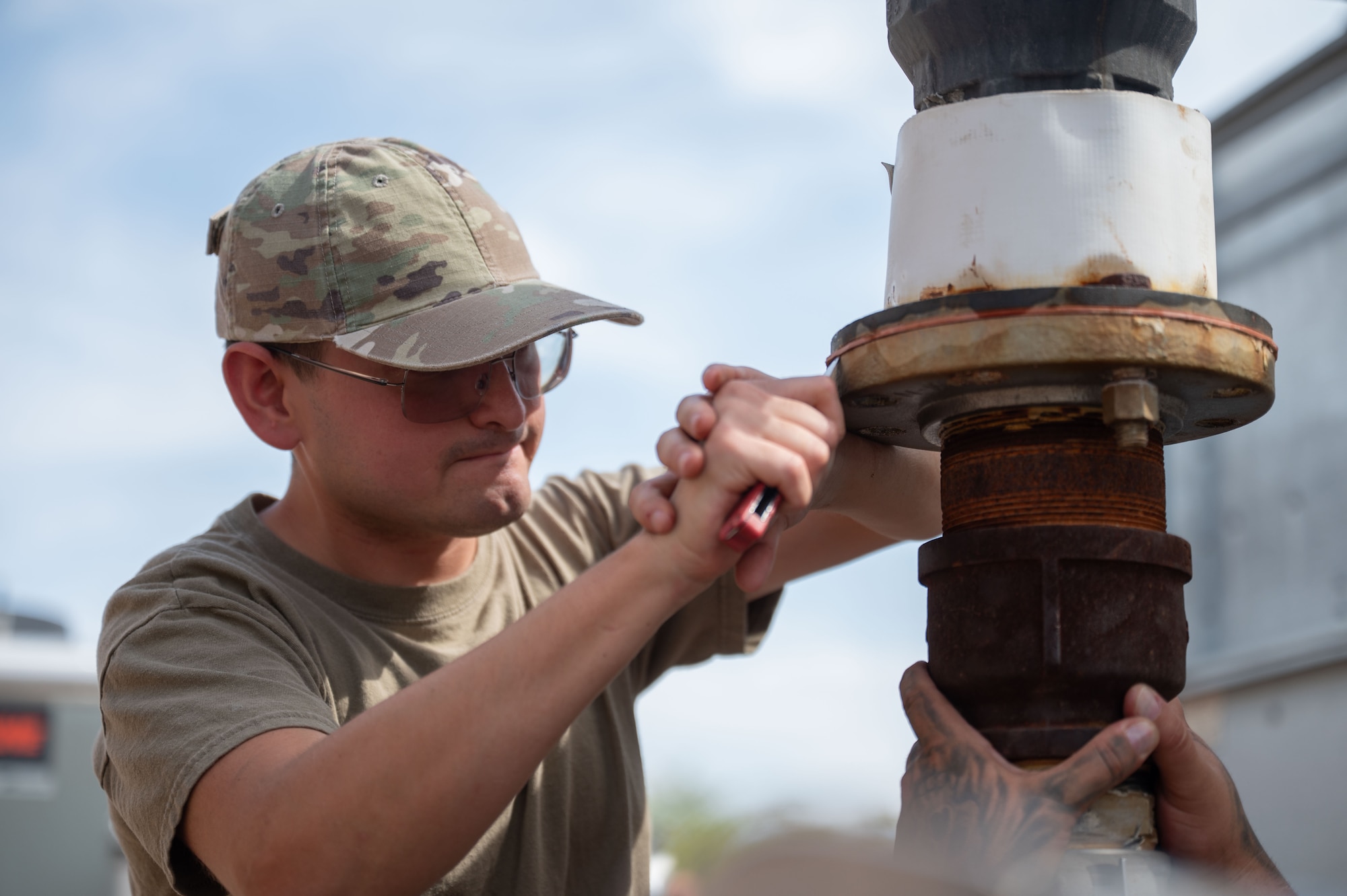 U.S. Air Force Airman 1st Class Jared Smith, 355th Civil Engineer Squadron Heating, Ventilation and Air Conditioning journeyman, performs maintenance on the Air Forces Southern Command HVAC system at Davis-Monthan Air Force Base, Arizona, Aug. 13, 2025. The HVAC team had one of its busiest summers, operating with fewer technicians due to many members deploying or undergoing a permanent change of station. (U.S. Air Force photo by Airman Jaden Kidd)