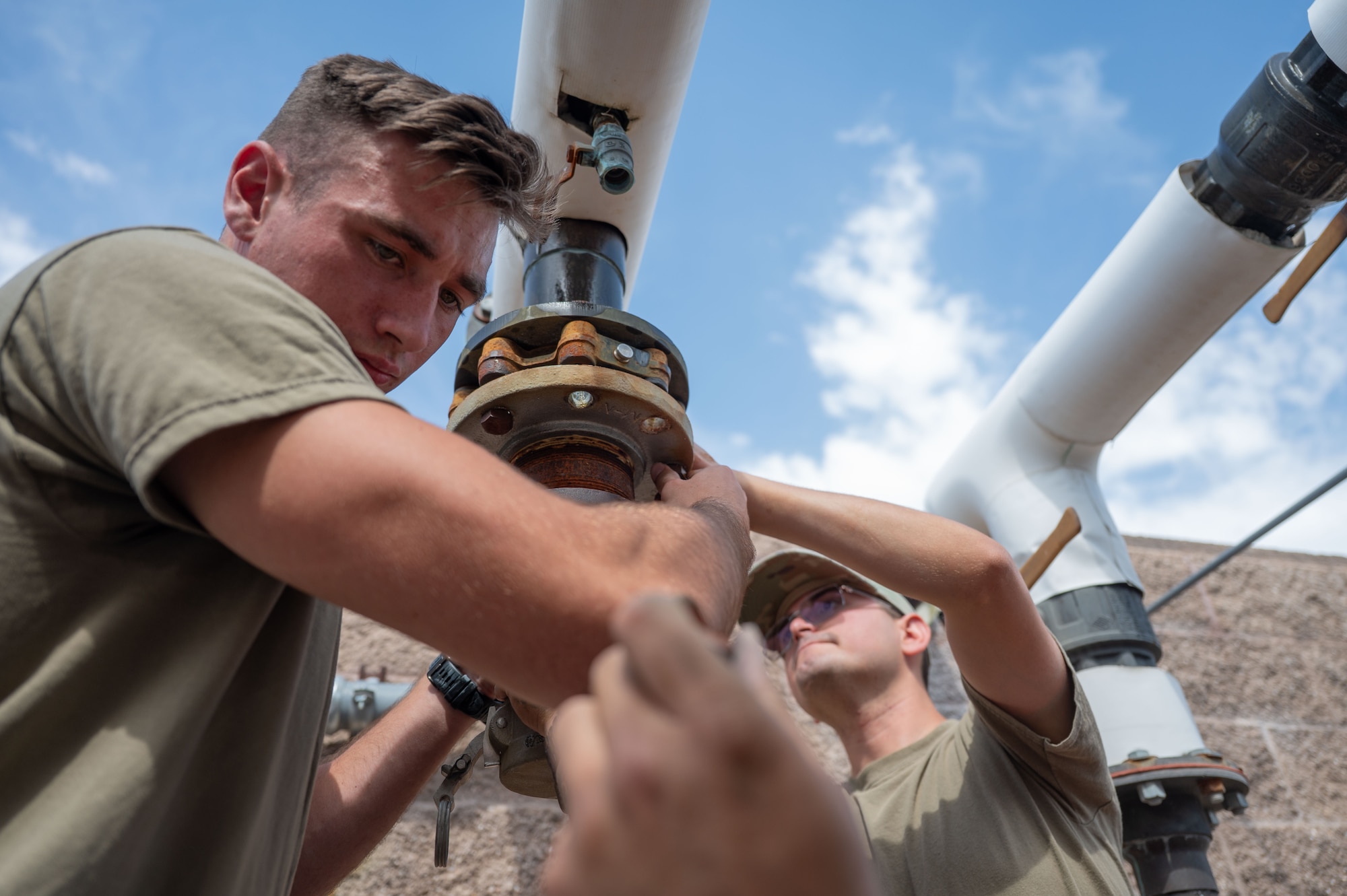 U.S. Air Force Airman 1st Class Jared Smith, 355th Civil Engineer Squadron Heating, Ventilation and Air Conditioning journeyman, performs maintenance on the Air Forces Southern Command HVAC system at Davis-Monthan Air Force Base, Arizona, Aug. 13, 2025. The HVAC team had one of its busiest summers, operating with fewer technicians due to many members deploying or undergoing a permanent change of station. (U.S. Air Force photo by Airman Jaden Kidd)