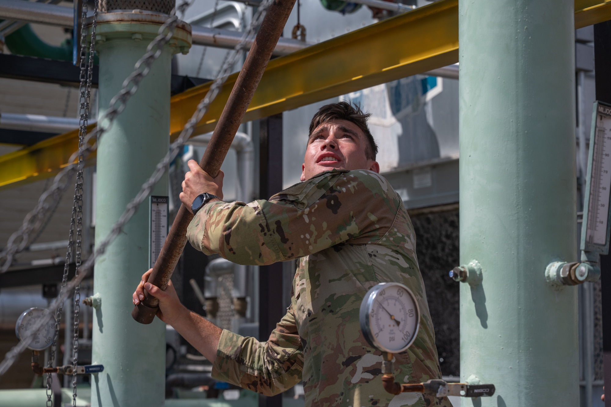 U.S. Air Force Airman 1st Class Aidan Perdreau, 355th Civil Engineer Squadron Heating, Ventilation and Air Conditioning apprentice, performs maintenance on the facility known as “The Beast” at Davis-Monthan Air Force Base, Arizona, Aug. 13, 2025. “The Beast” is a large HVAC facility that powers more than a quarter of the air conditioning at Davis-Monthan. (U.S. Air Force photo by Airman Jaden Kidd)
