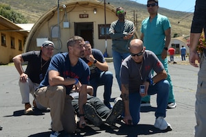 U.S. National Guard members prepare to lift an occupied litter