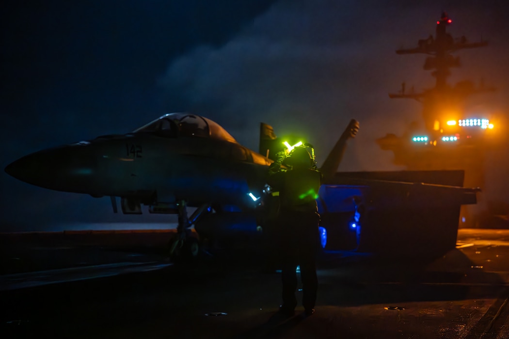 U.S. Navy Aviation Boatswain’s Mate (Handling) 1st Class Anna Perez, from Fardel, Minn., prepares to launch an F/A-18F Super Hornet, assigned to the “Flying Eagles” of Strike Fighter Squadron (VFA) 122, off the flight deck of the Nimitz-class aircraft carrier USS Theodore Roosevelt (CVN 71), Aug. 11, 2025.