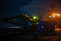 U.S. Navy Aviation Boatswain’s Mate (Handling) 1st Class Anna Perez, from Fardel, Minn., prepares to launch an F/A-18F Super Hornet, assigned to the “Flying Eagles” of Strike Fighter Squadron (VFA) 122, off the flight deck of the Nimitz-class aircraft carrier USS Theodore Roosevelt (CVN 71), Aug. 11, 2025.