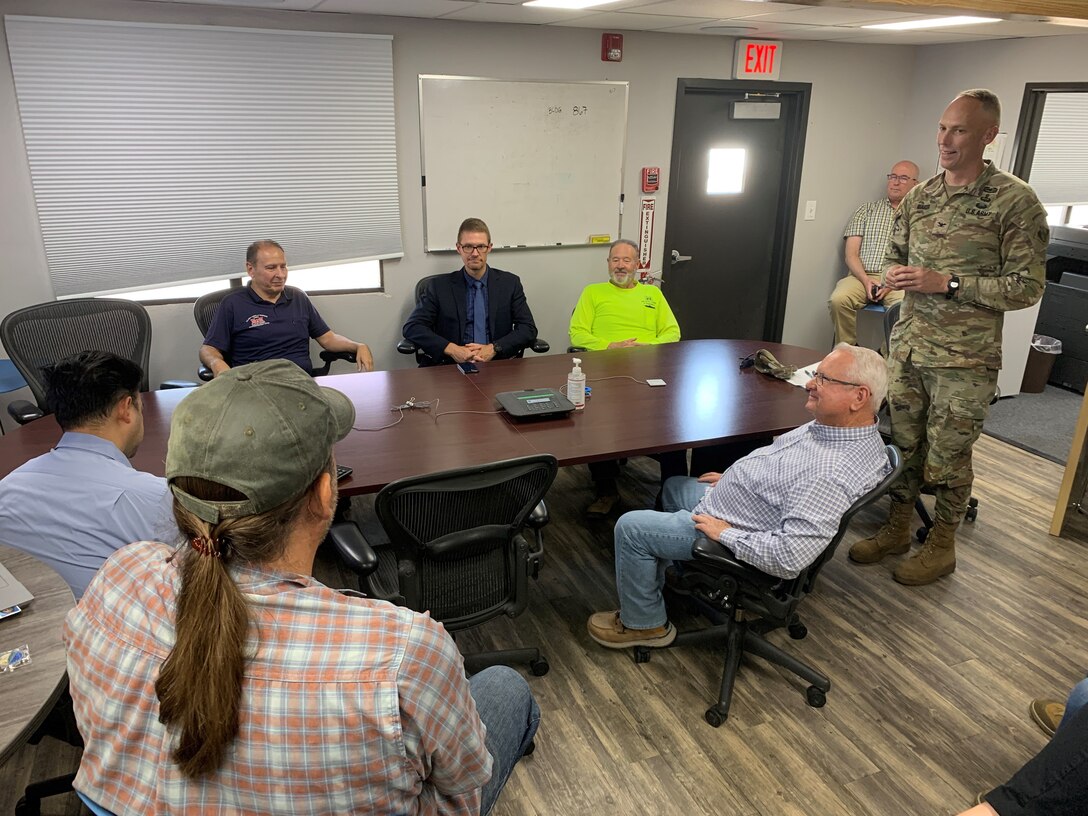 Los Angeles District Commander Col. Andrew Baker presents coins to several outstanding employees of the Nellis Resident Office July 15 at Nellis Air Force Base, Nevada, near Las Vegas.