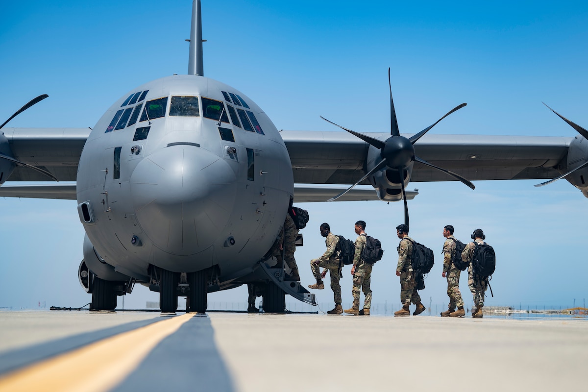 Airmen from the 4th Fighter Generation Squadron, Hill Air Force Base, Utah, climb into a C-130J Super Hercules assigned to the 41st Airlift Squadron, Little Rock Air Force Base, Ark., to participate in exercise Bamboo Eagle 25-3 at Naval Air Station Lemoore, Calif., Aug. 7, 2025. The exercise provides a combat-representative environment that pushes participants to enhance their readiness through realistic training and advanced tactics. (U.S. Air Force photo by Staff Sgt. Zachary Rufus)