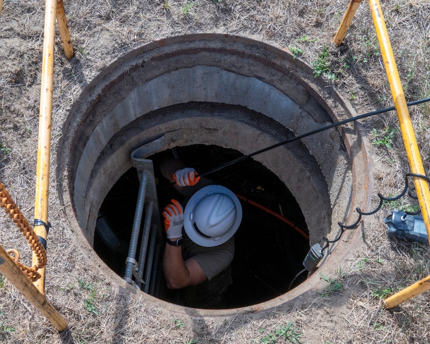 Technician in hole