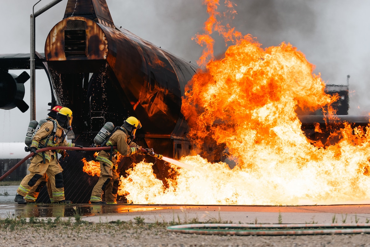 Airmen assigned to the 132nd Wing's Civil Engineer Squadron, Iowa Air National Guard, conduct aircraft firefighting training at the 119th Wing, North Dakota Air National Guard's Regional Training Site, Fargo, N.D., July 30, 2025. This exercise was one piece of a larger, comprehensive annual training for the squadron. (U.S. Army National Guard photo by Spc. Armani Wilson)